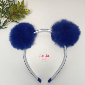 Tiara pompons de pelúcia azul