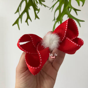 Laço vermelho com pompom branco